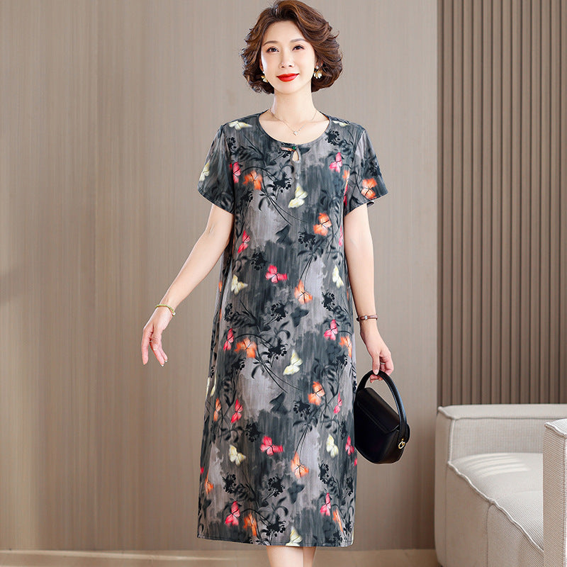 A middle-aged mother is wearing a cotton silk dress