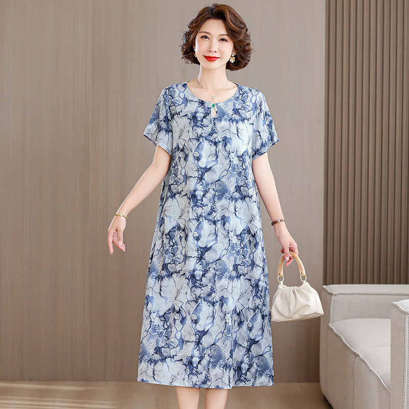 A middle-aged mother is wearing a cotton silk dress